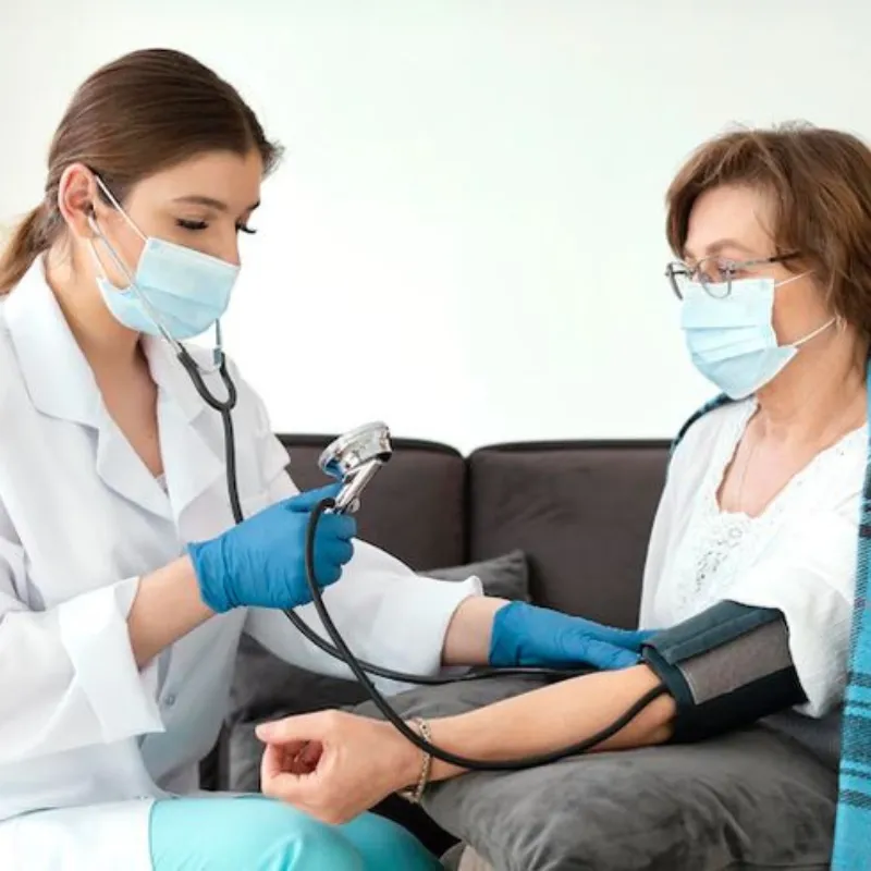 Experienced GP doctor providing medical consultation for a patient at a GP clinic in International City, Dubai
